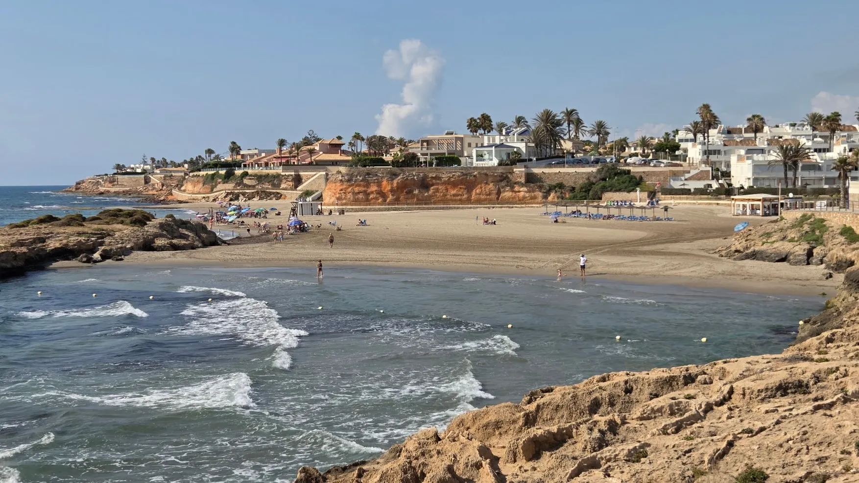 Cala Capitán cove with its small offshore island near La Zenia