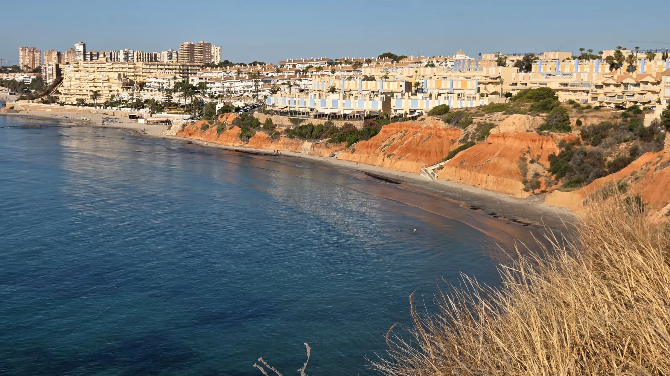 Rocky coves and clear water at Calas de Aguamarina near Campoamor